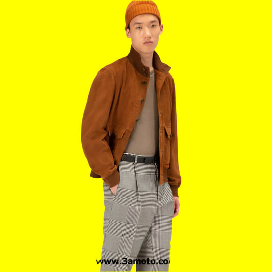 Person wearing a brown jacket, orange beanie, and plaid pants on a yellow background