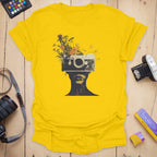 T-Shirt With Surreal Camera And Wildflower Artwork